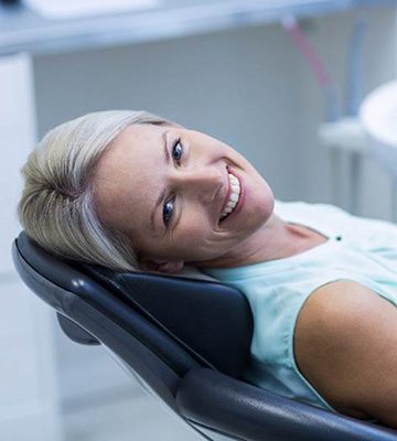 Woman leaning back after teeth whitening in Colleyville, TX