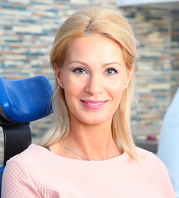 Smiling woman in dental chair