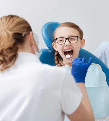 A child completing a dental exam.