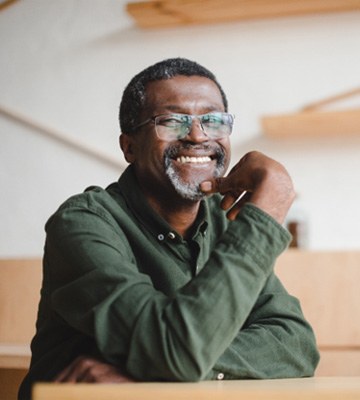 Man smiling with dentures in Colleyville 