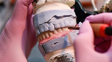 Lab technicians building dentures in Colleyville  