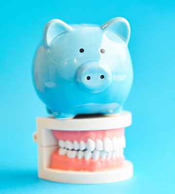 Piggy bank on top of dentures