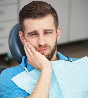 Man with toothache visiting his Colleyville emergency dentist