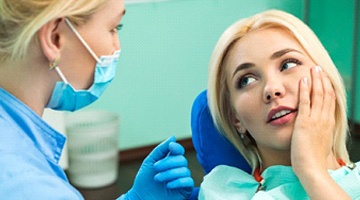 Woman with toothache in Colleyville talking to her dentist