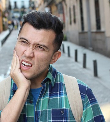 Man with toothache in Colleyville wondering if he should visit his dentist