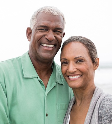 Smiling older man and woman outdoors