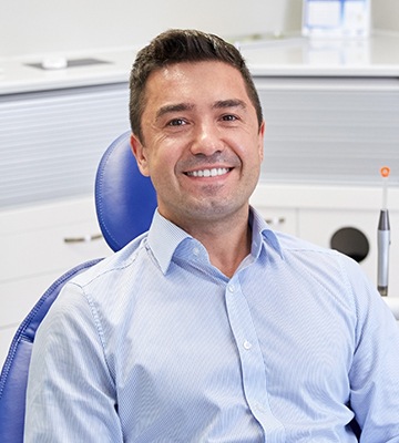 Smiling man in dental chair