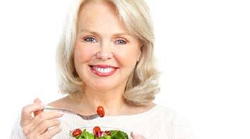 Woman eating salad in Colleyville