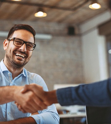 Man shaking hands with an implant dentist in Colleyville