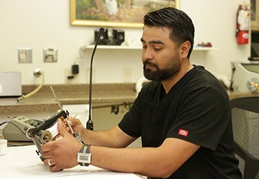 Colleyville dental team member working in dental lab