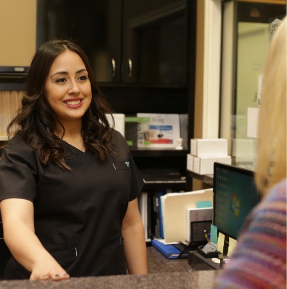 receptionist smiling at patient