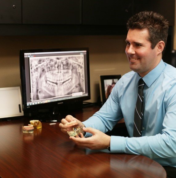 doctor showing patient a smile