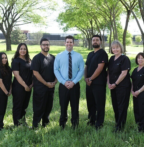 Colleyville dentist and dental team members standing outdoors