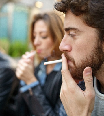 person smoking with their friends