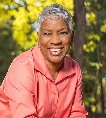 Older woman smiling outdoors