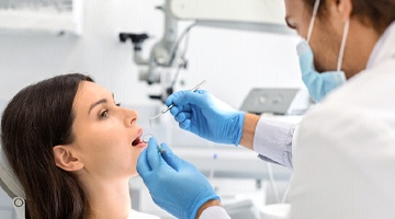 Woman visiting emergency dental office in Colleyville for checkup