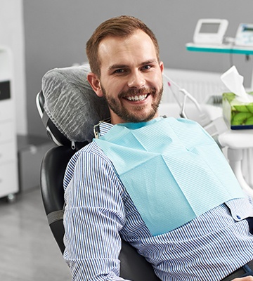 Smiling man in dental chair