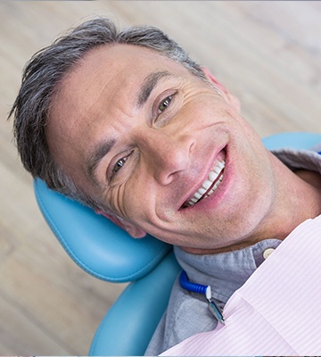 Smiling man in dental chair