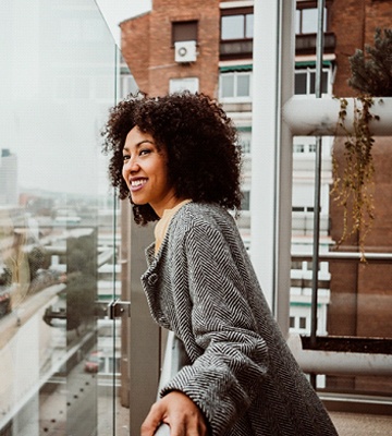 healthy person looking outside over their patio