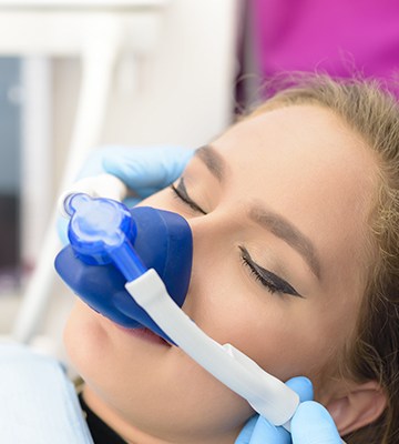 Woman with nitrous oxide nasal mask