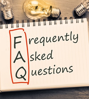 FAQ sign surrounded by lightbulbs