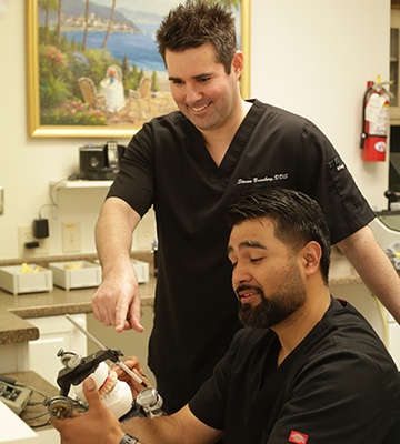 Dr. Branberg and team member in dental lab