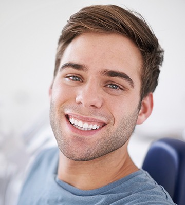 Smiling man in dental chair