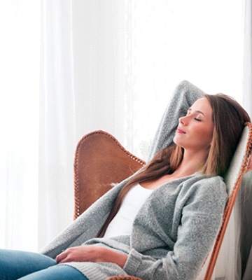 Woman relaxing at home following a tooth extraction