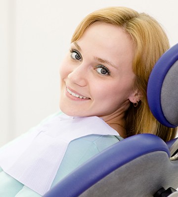 Smiling woman in dental chair