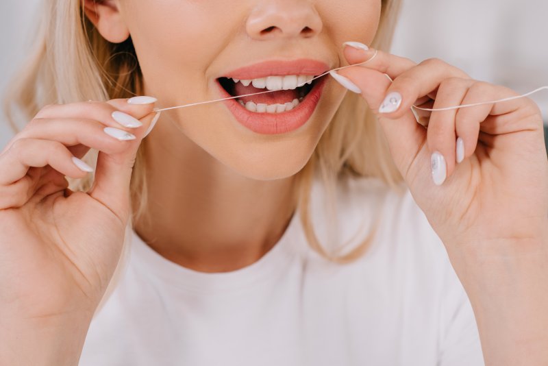 Woman flossing