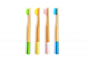 four bamboo toothbrushes, which are eco-friendly oral hygiene products 