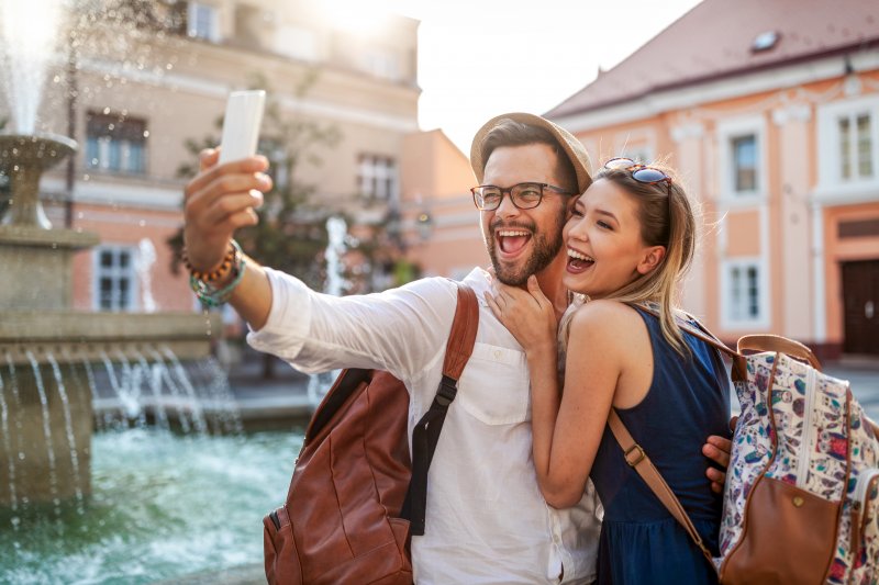 Couple smiling for a selfie during summer vacation