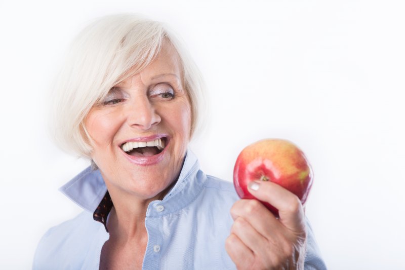 woman holding an apple