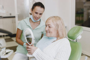 Senior female patient in dentist’s chair