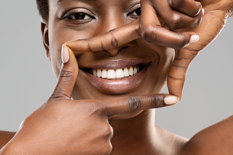 Woman smiling after teeth whitening