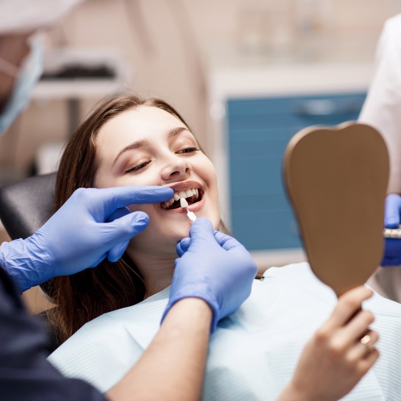 A dentist preparing to fix his patient’s smile