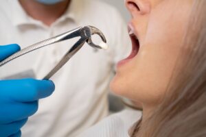 Woman getting her tooth pulled
