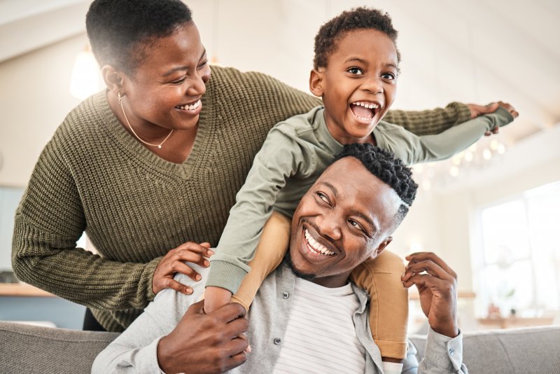 a family smiling and laughing together